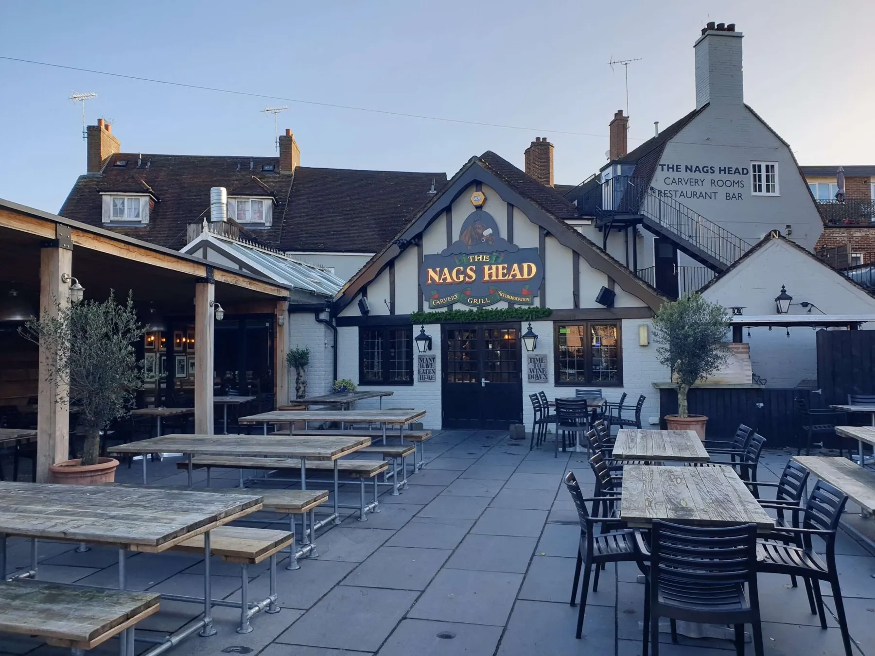 The courtyard garden at The Nags Head, set with benches and tables